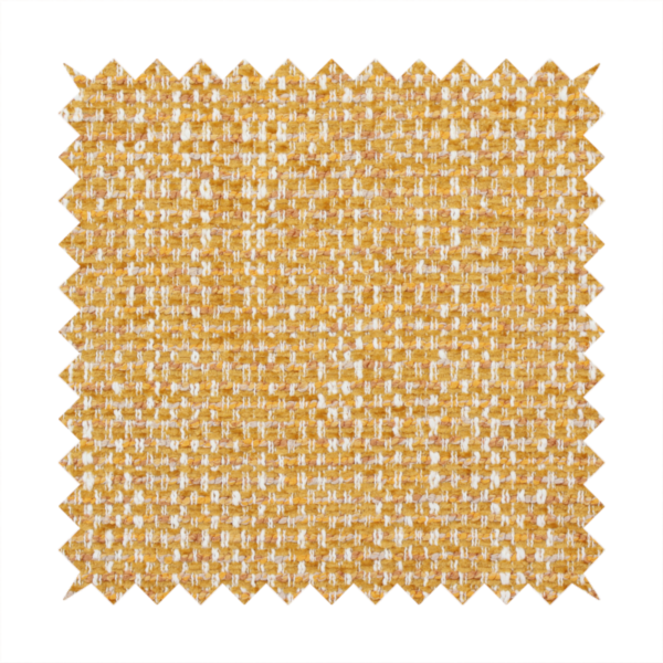 The material features a dense, multi-toned weave with a warm mustard yellow and ochre base, intricately interlaced with horizontal flecks of crisp white and soft beige threads throughout.