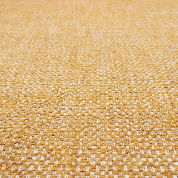 The material features a dense, multi-toned weave with a warm mustard yellow and ochre base, intricately interlaced with horizontal flecks of crisp white and soft beige threads throughout.