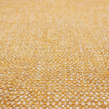 The material features a dense, multi-toned weave with a warm mustard yellow and ochre base, intricately interlaced with horizontal flecks of crisp white and soft beige threads throughout.