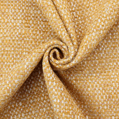 The material features a dense, multi-toned weave with a warm mustard yellow and ochre base, intricately interlaced with horizontal flecks of crisp white and soft beige threads throughout.