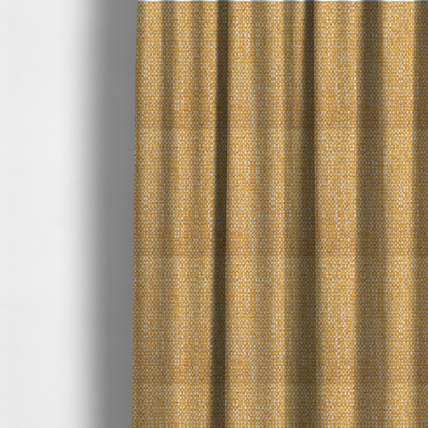 The fabric used to create these made-to-measure curtains is a material features a dense, multi-toned weave with a warm mustard yellow and ochre base, intricately interlaced with horizontal flecks of crisp white and soft beige threads throughout.