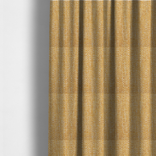 The fabric used to create these made-to-measure curtains is a material features a dense, multi-toned weave with a warm mustard yellow and ochre base, intricately interlaced with horizontal flecks of crisp white and soft beige threads throughout.