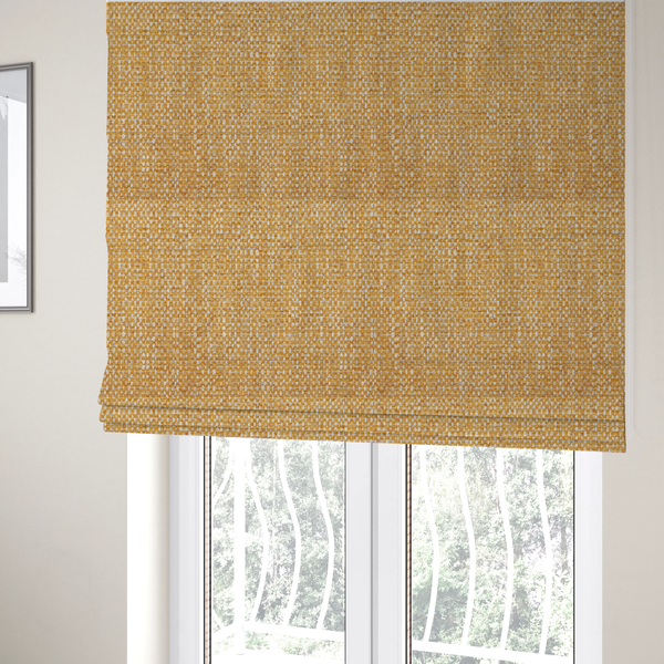 The fabric used to create these Roman blinds is a material features a dense, multi-toned weave with a warm mustard yellow and ochre base, intricately interlaced with horizontal flecks of crisp white and soft beige threads throughout.