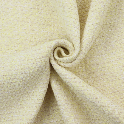 The material features a dense, light-toned weave with a pale cream base, subtly interlaced with horizontal flecks of soft pastel yellow and light beige threads throughout.