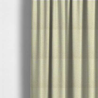 The fabric used to create these made-to-measure curtains is a material features a dense, light-toned weave with a pale cream base, subtly interlaced with horizontal flecks of soft pastel yellow and light beige threads throughout.