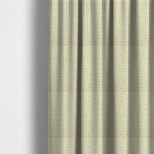 The fabric used to create these made-to-measure curtains is a material features a dense, light-toned weave with a pale cream base, subtly interlaced with horizontal flecks of soft pastel yellow and light beige threads throughout.