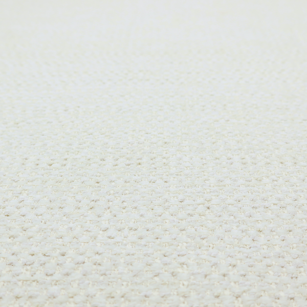 The material features a dense, minimalist weave in a uniform bright cream or off-white colour, highlighting the subtle horizontal texture of the interlaced threads.