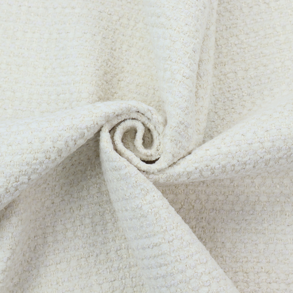 The material features a dense, minimalist weave in a uniform bright cream or off-white colour, highlighting the subtle horizontal texture of the interlaced threads.