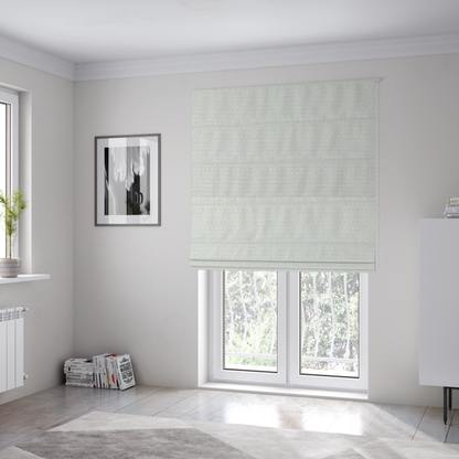 The fabric used to create these Roman blinds is a material features a dense, minimalist weave in a uniform bright cream or off-white colour, highlighting the subtle horizontal texture of the interlaced threads.