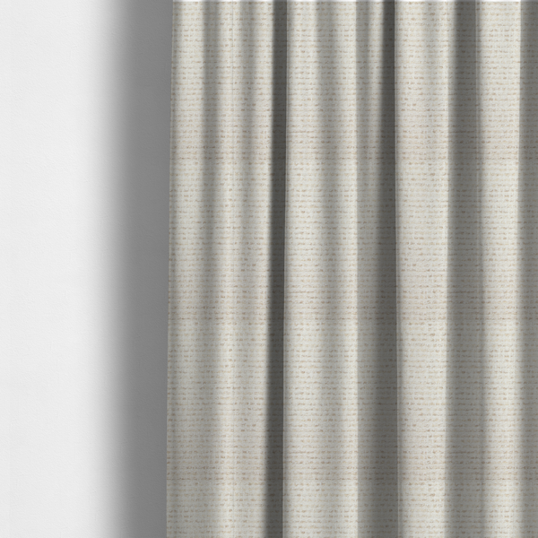 The fabric used to create these made-to-measure curtains is a material features a dense, neutral weave with a light cream base, subtly interlaced with horizontal flecks of soft beige and oatmeal-coloured threads throughout.