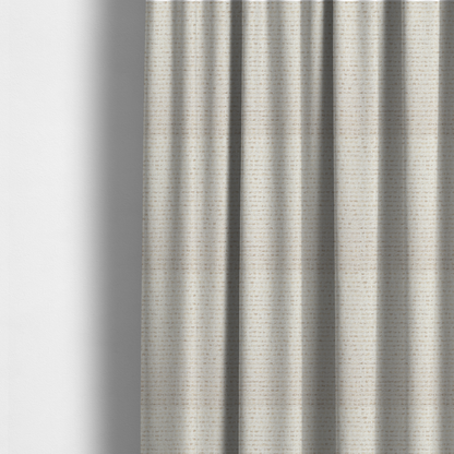 The fabric used to create these made-to-measure curtains is a material features a dense, neutral weave with a light cream base, subtly interlaced with horizontal flecks of soft beige and oatmeal-coloured threads throughout.