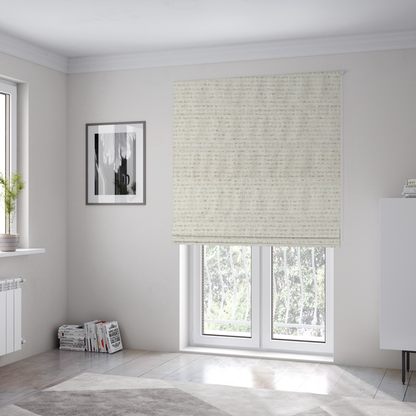 The fabric used to create these Roman blinds is a material features a dense, neutral weave with a light cream base, subtly interlaced with horizontal flecks of soft beige and oatmeal-coloured threads throughout.