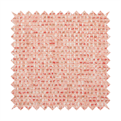 The material features a dense, warm-toned weave with a soft coral pink and peach base, intricately interlaced with horizontal flecks of terracotta red, beige, and white threads throughout.