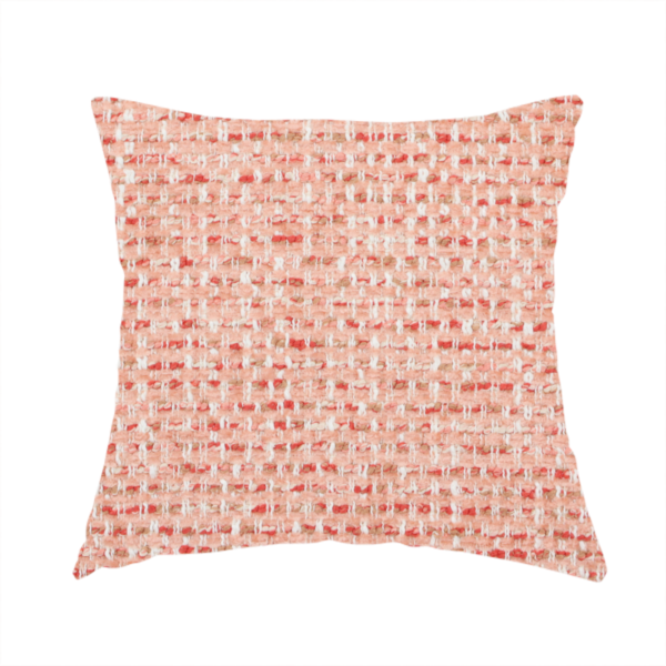 The fabric used to create this handmade cushion is a material features a dense, warm-toned weave with a soft coral pink and peach base, intricately interlaced with horizontal flecks of terracotta red, beige, and white threads throughout.