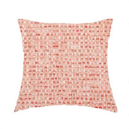 The fabric used to create this handmade cushion is a material features a dense, warm-toned weave with a soft coral pink and peach base, intricately interlaced with horizontal flecks of terracotta red, beige, and white threads throughout.