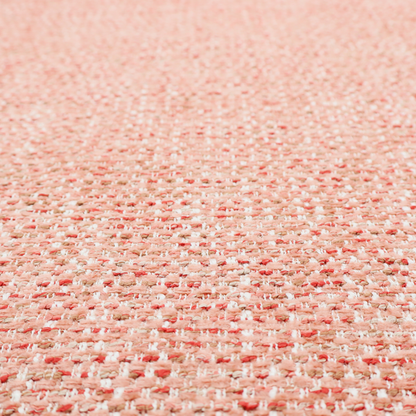 The material features a dense, warm-toned weave with a soft coral pink and peach base, intricately interlaced with horizontal flecks of terracotta red, beige, and white threads throughout.