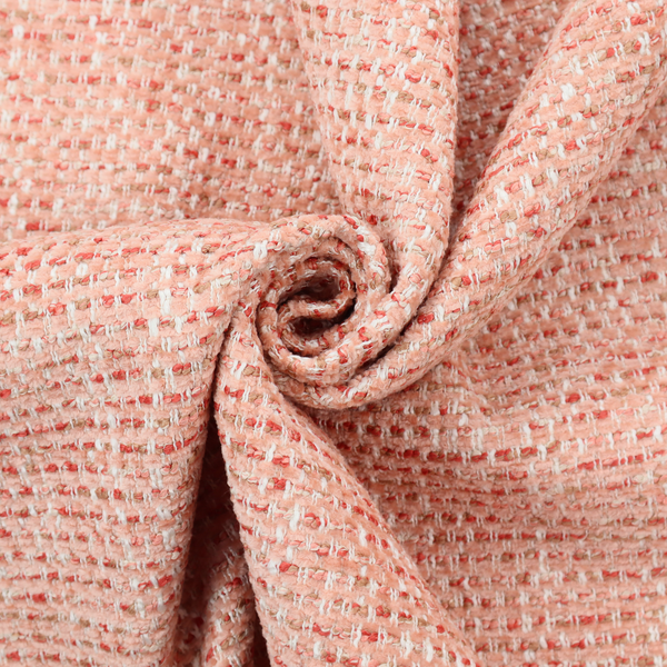 The material features a dense, warm-toned weave with a soft coral pink and peach base, intricately interlaced with horizontal flecks of terracotta red, beige, and white threads throughout.