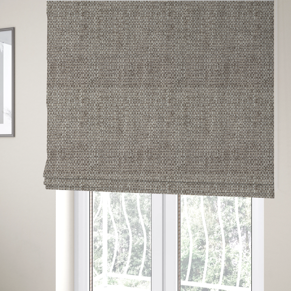 The fabric used to create these Roman blinds is a material features a dense, multi-toned weave with a cool taupe and light brown base, intricately interlaced with horizontal flecks of cream and off-white threads throughout
