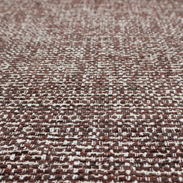 The material features a dense, multi-toned weave with a deep chocolate brown base, intricately interlaced with prominent horizontal flecks of crisp white and dark charcoal grey threads throughout.