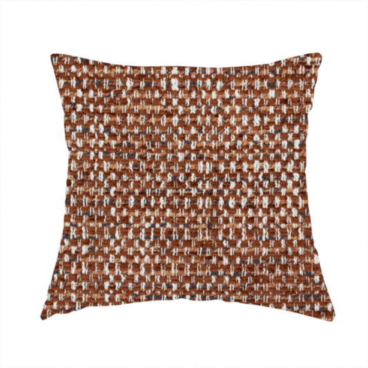 The fabric used to create this handmade cushion is a material features a dense, multi-toned weave with a warm rust orange and terracotta base, intricately interlaced with prominent horizontal flecks of crisp white and dark charcoal brown threads throughout.