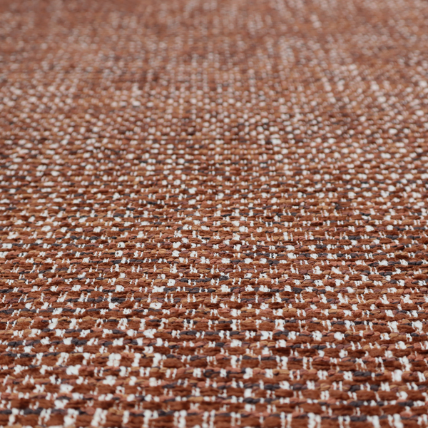 The material features a dense, multi-toned weave with a warm rust orange and terracotta base, intricately interlaced with prominent horizontal flecks of crisp white and dark charcoal brown threads throughout.