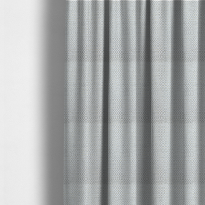 The fabric used to create these made-to-measure curtains is a material features a dense, multi-toned neutral weave with a pale grey and silver-toned base, intricately interlaced with horizontal flecks of soft cream and off-white threads throughout.