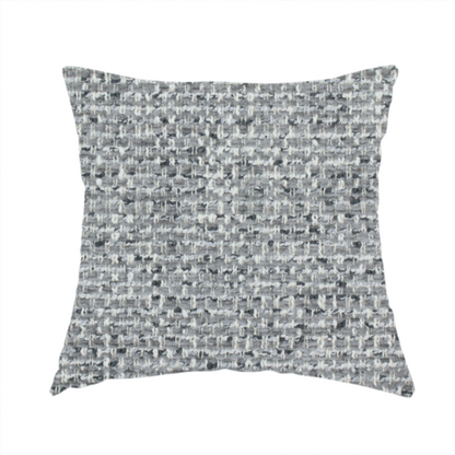 The fabric used to create this handmade cushion is a material features a dense, multi-toned weave with a mid-grey base, intricately interlaced with horizontal flecks of crisp white and dark charcoal grey threads throughout.