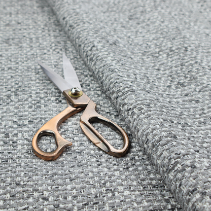 The material features a dense, multi-toned weave with a mid-grey base, intricately interlaced with horizontal flecks of crisp white and dark charcoal grey threads throughout.
