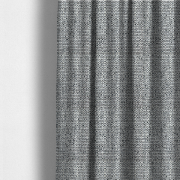 The fabric used to create these made-to-measure curtains is a material features a dense, multi-toned weave with a mid-grey base, intricately interlaced with horizontal flecks of crisp white and dark charcoal grey threads throughout.