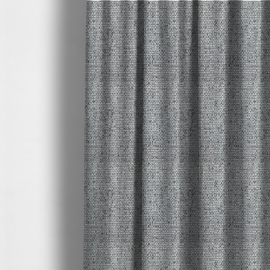 The fabric used to create these made-to-measure curtains is a material features a dense, multi-toned weave with a mid-grey base, intricately interlaced with horizontal flecks of crisp white and dark charcoal grey threads throughout.