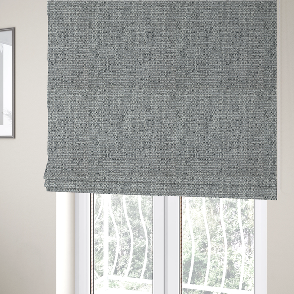 the fabric used to create these Roman blinds is a material features a dense, multi-toned weave with a mid-grey base, intricately interlaced with horizontal flecks of crisp white and dark charcoal grey threads throughout.