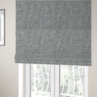 the fabric used to create these Roman blinds is a material features a dense, multi-toned weave with a mid-grey base, intricately interlaced with horizontal flecks of crisp white and dark charcoal grey threads throughout.