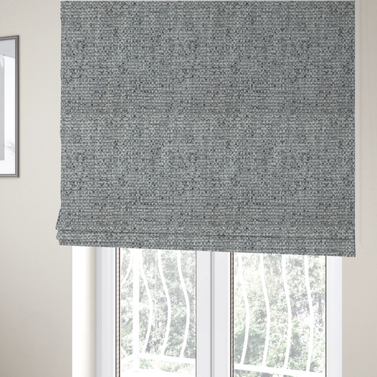the fabric used to create these Roman blinds is a material features a dense, multi-toned weave with a mid-grey base, intricately interlaced with horizontal flecks of crisp white and dark charcoal grey threads throughout.