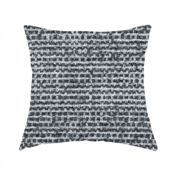 The fabric used to create this handmade cushion is a material features a dense, multi-toned weave with a dark charcoal grey and slate base, intricately interlaced with prominent horizontal flecks of crisp white and lighter grey threads throughout.