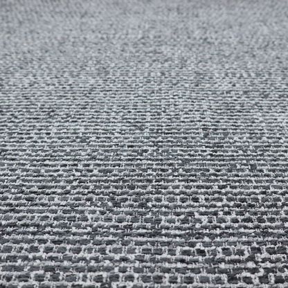 The material features a dense, multi-toned weave with a dark charcoal grey and slate base, intricately interlaced with prominent horizontal flecks of crisp white and lighter grey threads throughout.