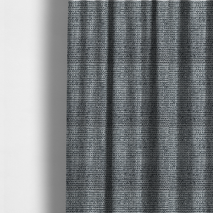 The fabric used to create these curtains is a material features a dense, multi-toned weave with a dark charcoal grey and slate base, intricately interlaced with prominent horizontal flecks of crisp white and lighter grey threads throughout.