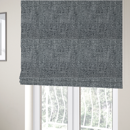 the fabric used to create these Roman blinds is a  material features a dense, multi-toned weave with a dark charcoal grey and slate base, intricately interlaced with prominent horizontal flecks of crisp white and lighter grey threads throughout.