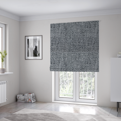 the fabric used to create these Roman blinds is a  material features a dense, multi-toned weave with a dark charcoal grey and slate base, intricately interlaced with prominent horizontal flecks of crisp white and lighter grey threads throughout.