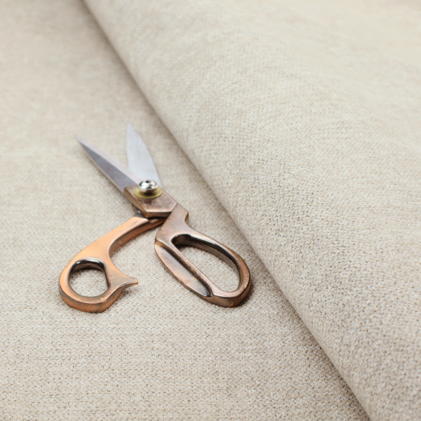 A beige or oatmeal woven fabric with a fine, textured basket weave pattern.