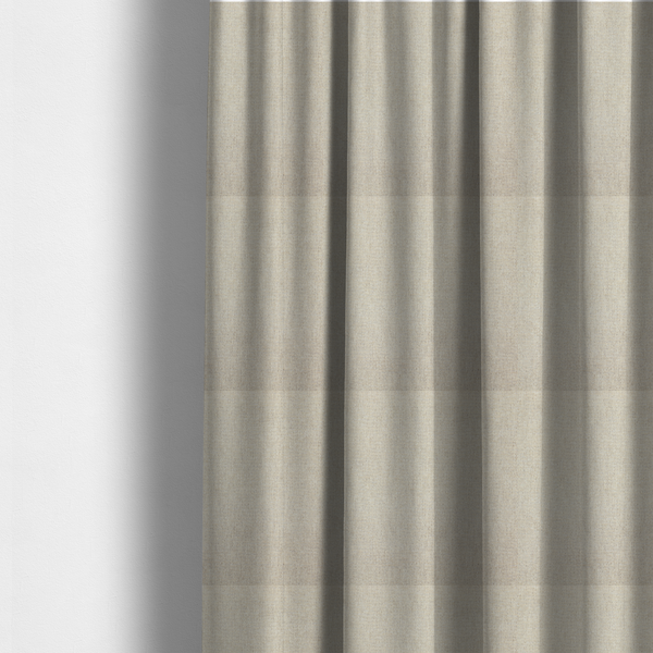 The fabric used to create these made-to-measure curtains is a beige or oatmeal woven fabric with a fine, textured basket weave pattern.