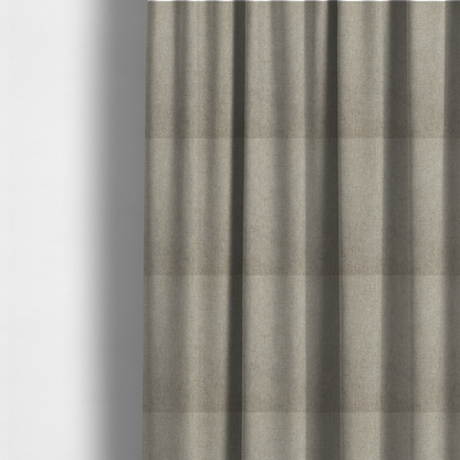 The fabric used to create these made-to-measure curtains is a taupe or dark beige woven fabric with a fine, heathered texture.
