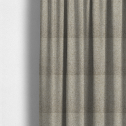 The fabric used to create these made-to-measure curtains is a taupe or dark beige woven fabric with a fine, heathered texture.