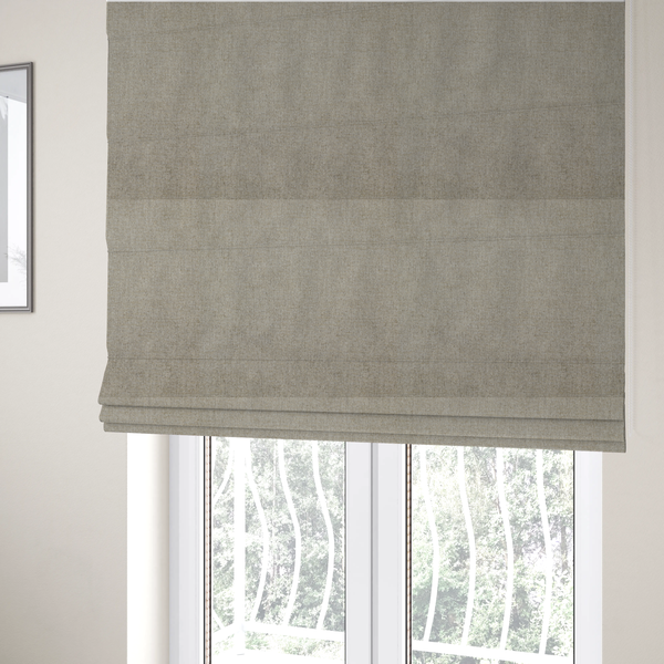 The fabric used to create these Roman blinds is a taupe or dark beige woven fabric with a fine, heathered texture.