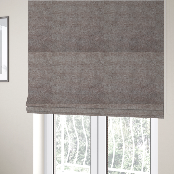 The fabric used to create these Roman blinds is a mocha brown or mink-coloured woven fabric with a fine, heathered texture.