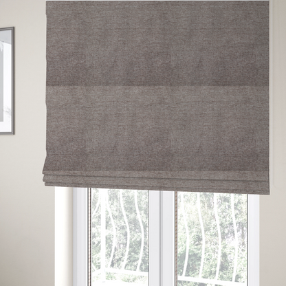 The fabric used to create these Roman blinds is a mocha brown or mink-coloured woven fabric with a fine, heathered texture.