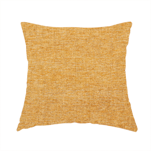 The fabric used to create this handmade cushion is a vibrant mustard yellow woven fabric with a fine, heathered texture.