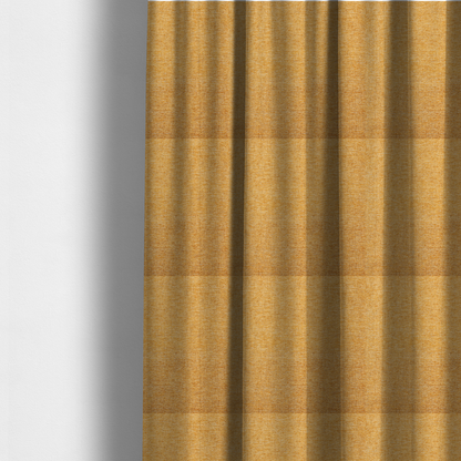 The fabric used to create these made-to-measure curtains is a vibrant mustard yellow woven fabric with a fine, heathered texture.