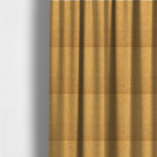 The fabric used to create these made-to-measure curtains is a vibrant mustard yellow woven fabric with a fine, heathered texture.