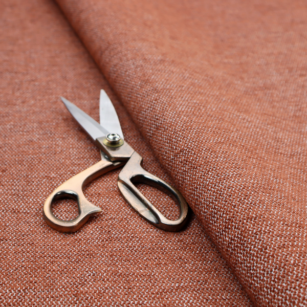 A vibrant terracotta orange woven fabric with a fine, heathered texture.