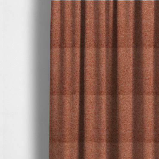 The fabric used to create these made-to-measure curtains is a vibrant terracotta orange woven fabric with a fine, heathered texture.